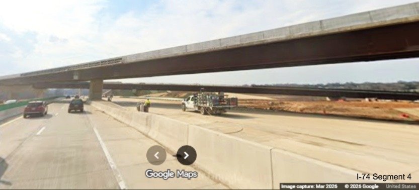 Image looking across future I-40 West lanes at flyover ramp bridge from I-40 East
	 to the I-74 West Beltway in the Winston-Salem Northern Beltway interchange work zone, screen grab from Google Maps Street View,
	 March 2026