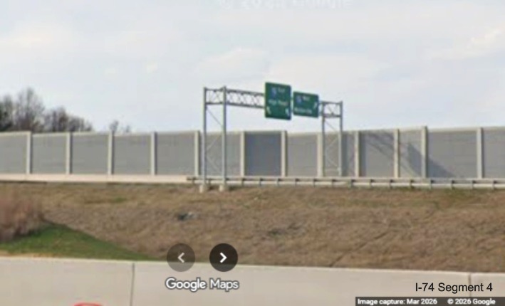 Image zoomed in looking across future I-40 West lanes at overhead signage on the
	 future flyover ramp from I-40 West to the I-74 West Beltway in the Winston-Salem Northern Beltway interchange work zone, 
	 screen grab from Google Maps Street View, March 2026