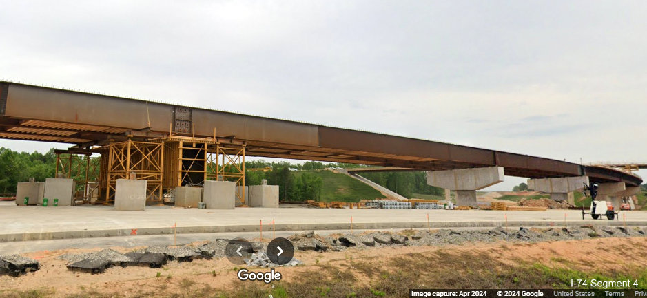 Image of new steel support beams for flyover ramp in the future I-74/Winston-Salem Northern 
        Beltway interchange construction zone on I-40 East in Forsyth County, Google Maps Street View, April 2024