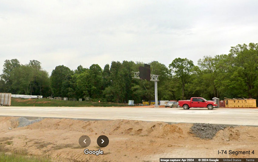 Image of covered up overhead advance sign on future I-40 East lanes in the I-74/Winston-Salem Northern 
        Beltway interchange construction zone in Forsyth County, Google Maps Street View, April 2024