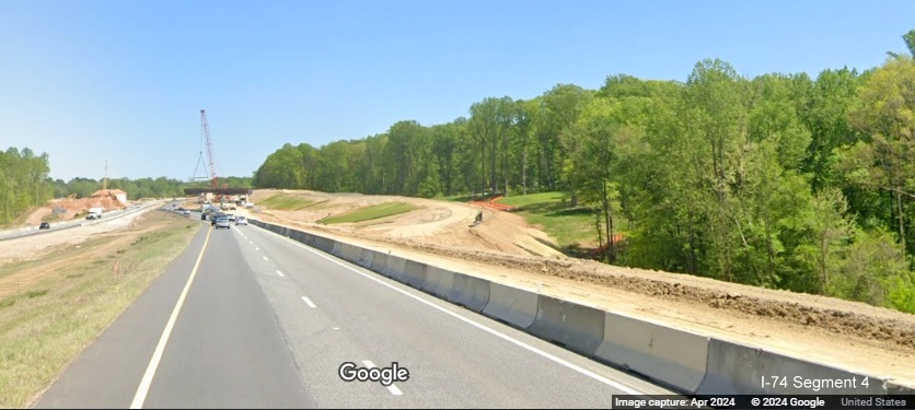 Image of approaching the future exit ramp for I-74 West/Winston-Salem Northern 
        Beltway on current I-74 East, Google Maps Street View, April 2024