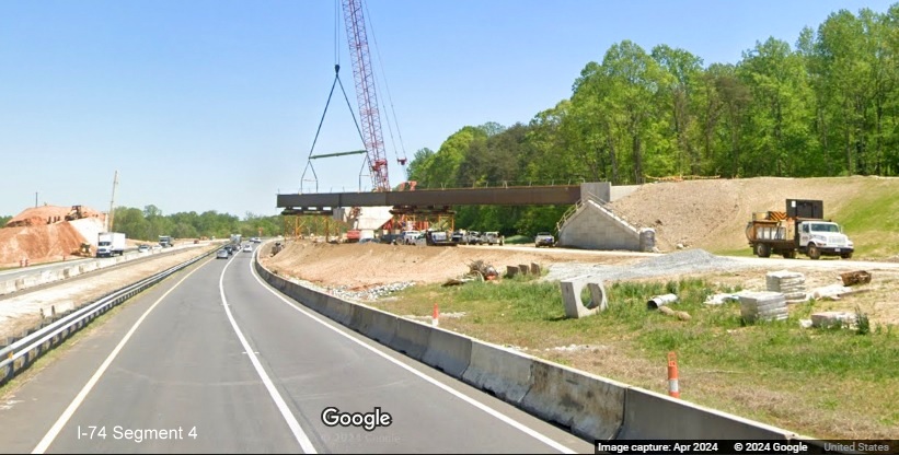 Image of construction of ramp bridge for the I-74 West/Winston-Salem Northern Beltway interchange
        on I-74 East, Google Maps Street View, April 2024