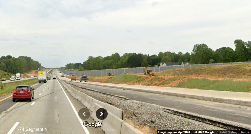 Image of approaching noise wall along future ramp from I-74/Winston-Salem Northern 
        Beltway West on I-40 East in Forsyth County, Google Maps Street View, April 2024