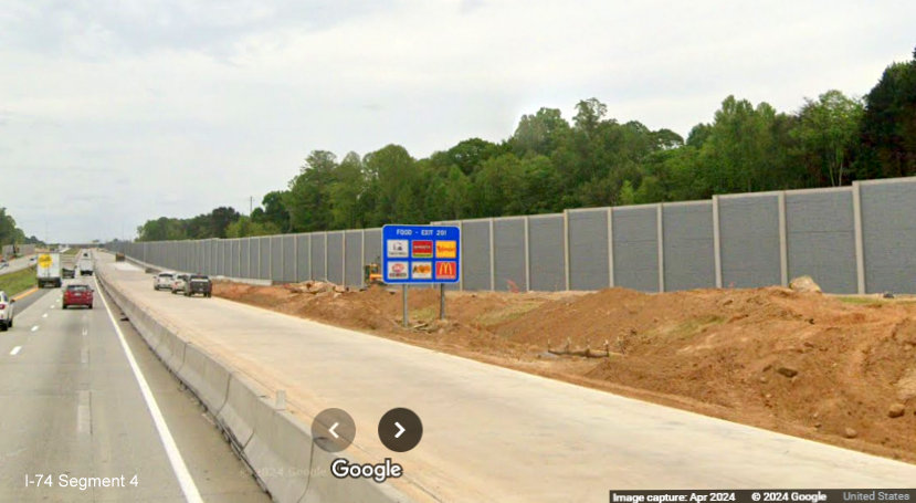 Image of completed noise wall approaching I-40 East from future I-74/Winston-Salem Northern 
        Beltway West ramp on I-40 East in Forsyth County, Google Maps Street View, April 2024