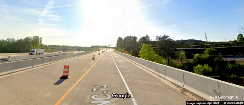 Image of West NC 74 (Future I-74) temporarily using US 52 South/Future I-274 Beltway ramp crossing
        Grassy Creek, Google Maps Street View, April 2024