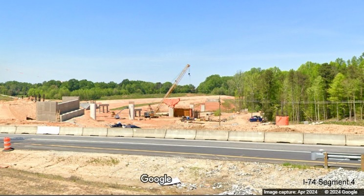 Image of Winston-Salem Northern Beltway interchange work zone across I-74 West, Google 
        Maps Street View, April 2024