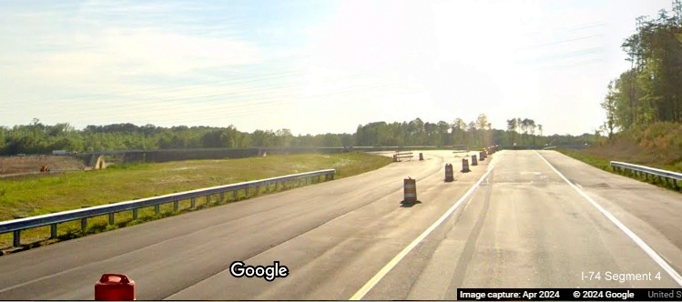 Image of approaching the future US 52 South/Future I-274 Beltway ramp and bridge from temporary NC 74 West lanes,
        Google Maps Street View, April 2024