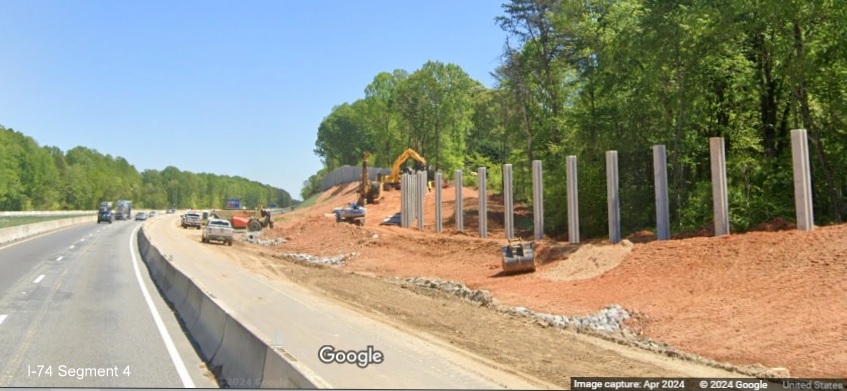 Image of noise wall construction along I-74 East in the Winston-Salem Northern Beltway 
        interchange work zone, Google Maps Street View, April 2024