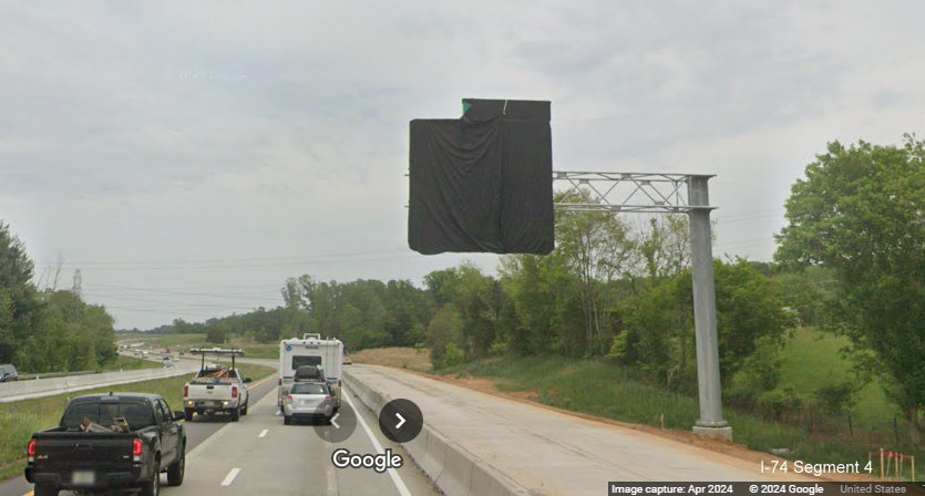 Image of new overhead advance sign for future I-74/Winston-Salem Northern Beltway interchange 
       covered over on I-40 East in Forsyth County, Google Maps Street View, April 2024