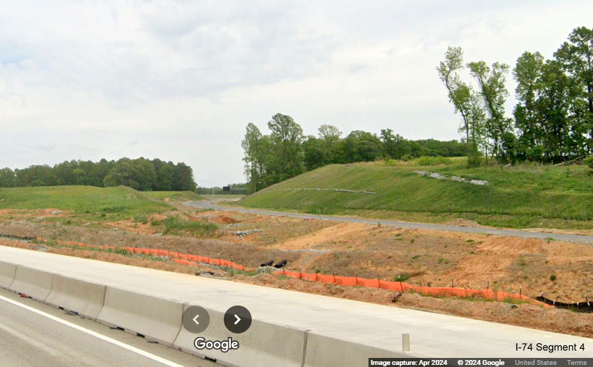 Image of future ramp to I-74/Winston-Salem Northern Beltway with signage up as seen from 
       I-40 East in Forsyth County, Google Maps Street View, April 2024