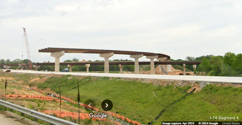 Image of new flyover ramps under construction for future I-74/Winston-Salem Northern Beltway 
        interchange as seen from current I-40 East in Forsyth County, Google Maps Street View, April 2024