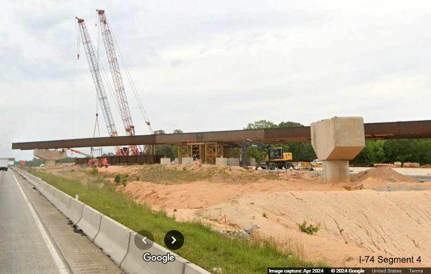 Image of new flyover ramp under construction in the I-74/Winston-Salem Northern Beltway interchange 
       construction zone on I-40 East in Forsyth County, Google Maps Street View, April 2024