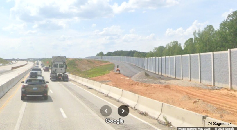 Image of future I-74 East/Winston-Salem Northern Beltway off-ramp with noise wall
	  continuing along it on I-40 West, Google Maps Street View, May 2025