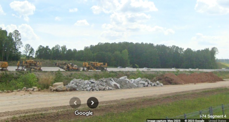 Image of completed I-40 East lanes in the vicinity of the I-74/Winston-Salem 
	  Northern Beltway interchange from I-40 West, Google Maps Street View, May 2025
