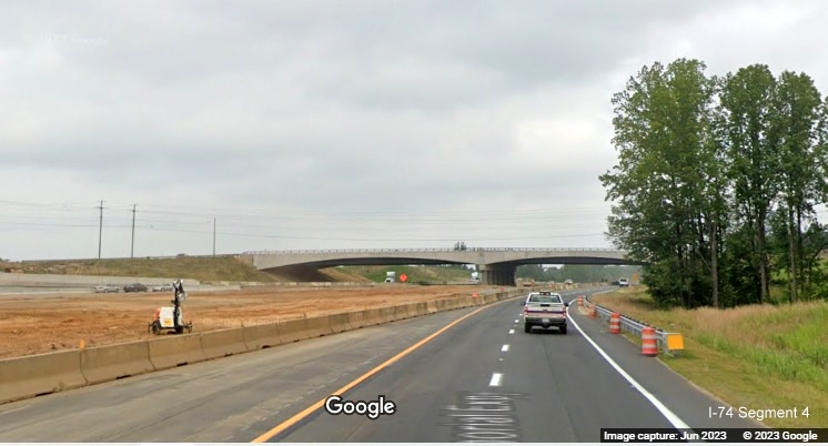 Image of US 52 North lanes using future C/D ramp roadway paralleling future I-74 West lanes 
        still under construction as part of the future Winston-Salem Northern Beltway interchange construction project, Google Maps Street View,         June 2023