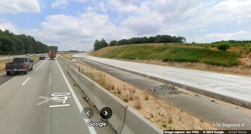 Image of still to be placed concrete roadway at future shift to new lanes for I-40 East in
        the future I-74/Winston-Salem Northern Beltway interchage work zone, Google Maps Street View, June 2024