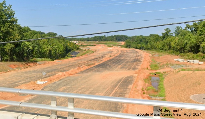Image looking west from the Stanleyville Drive bridge toward NC 66/University Parkway along the future NC 74/Winston-Salem Northern Beltway, Google Maps Street View image, August 2021