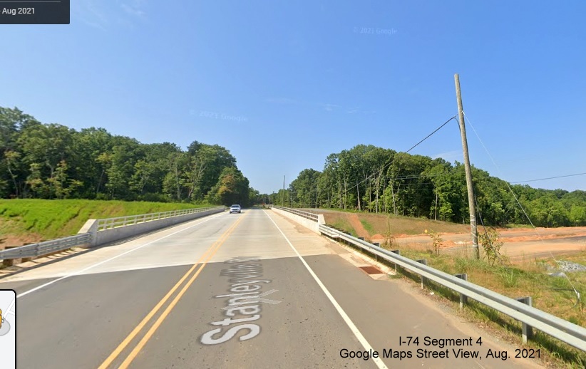 Image looking across the Stanleyville Drive bridge over the future NC 74/Winston-Salem Northern Beltway, Google Maps Street View image, August 2021