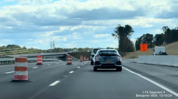 Image of the approaching the future ramp to US 52 South on the NC 74 (Future I-74) 
        Winston-Salem Beltway lanes, screen grab from Benjamin Wolf video, October 2024