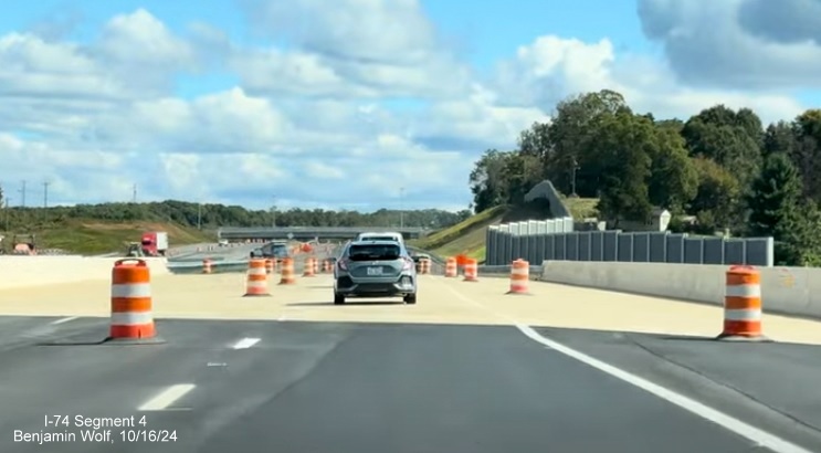 Image of approaching the completed Grassy Creek bridge on the new NC 74 (Future I-74) 
        Winston-Salem Beltway lanes, screen grab from Benjamin Wolf video, October 2024