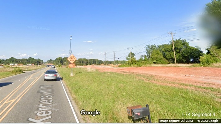 Image looking at grading of temporary roadway taking Kernersville Road through future I-74/Winston-Salem Northern Beltway 
       interchange construction area, Google Maps Street View image, July 2023