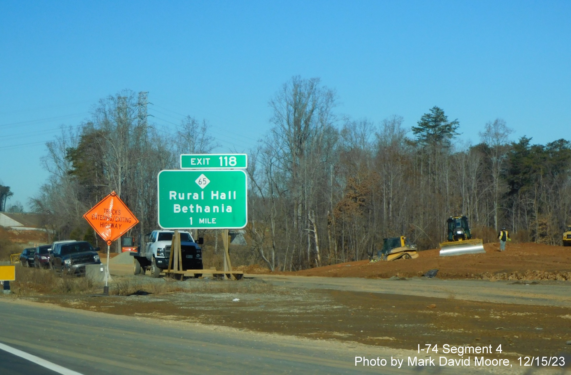 Image of US 52 North at the future off-ramp to NC 74 East/Winston-Salem Northern
      Beltway after the Ziglar Road bridge, by Mark David Moore, December 2023