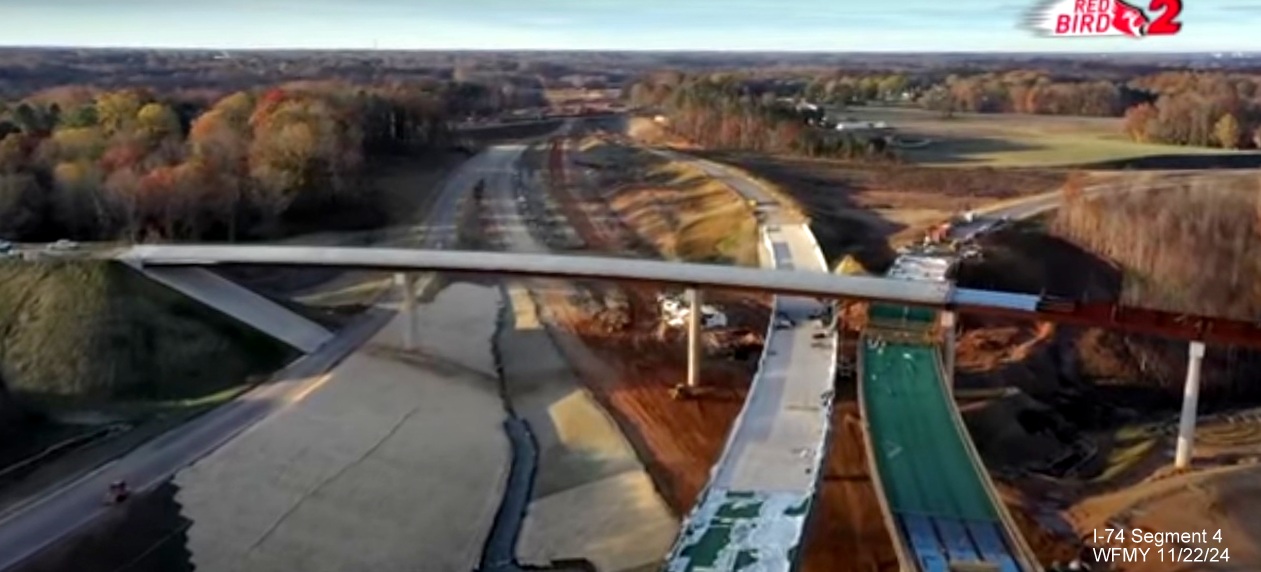 Image of overhead view of ramp construction as part of I-40/I-74 Winston-Salem Northern 
        Beltway interchange construction, screen grab from WFMY News story, November 2024