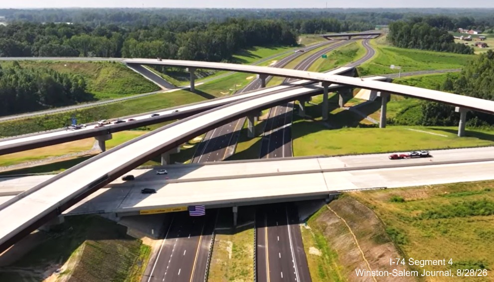 Image from Winston-Salem Journal video above the nearly completed I-40/I-74 
	 Beltway interchange after the official ribbon cutting ceremony, August 2026
