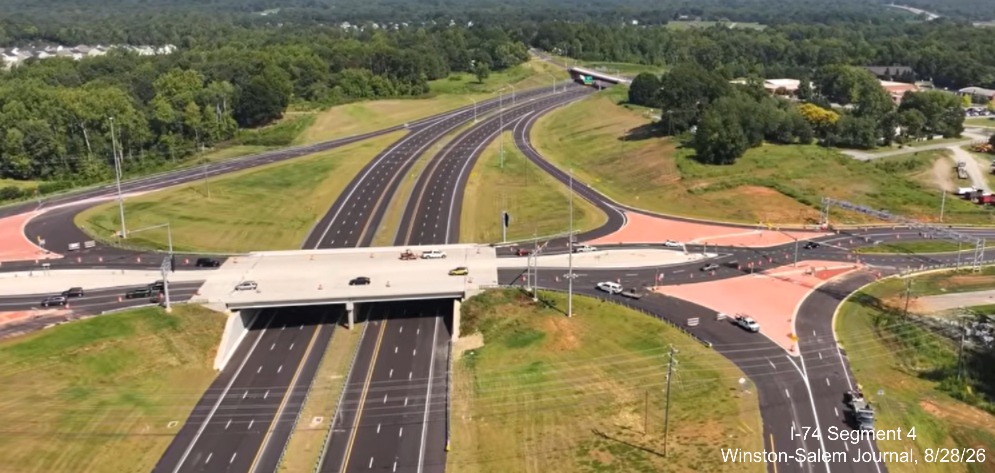 Image from Winston-Salem Journal video above the nearly completed Kernersville 
	 Road interchange showing completed DDI interchange, August 2026