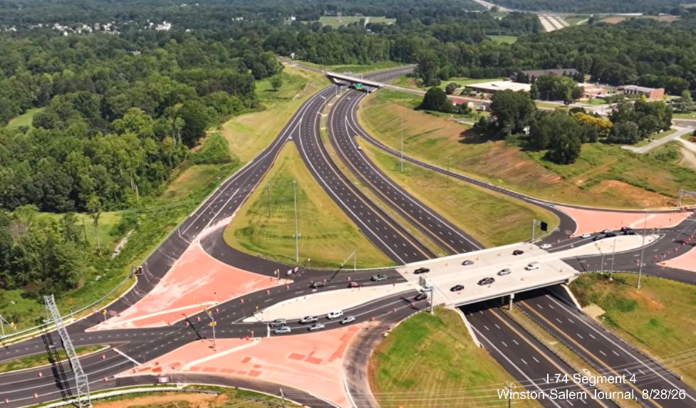 Image from Winston-Salem Journal video above the nearly completed Kernersville 
	 Road interchange showing completed DDI interchange, August 2026