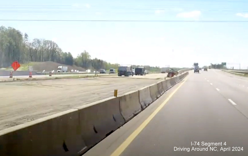 Image after NC 65 bridge on US 52 South of future permanent NC 74 (Future I-74) East ramp being finished, 
        current traffic using Future I-74 West lanes, screen grab from Driving Around NC, April 2024