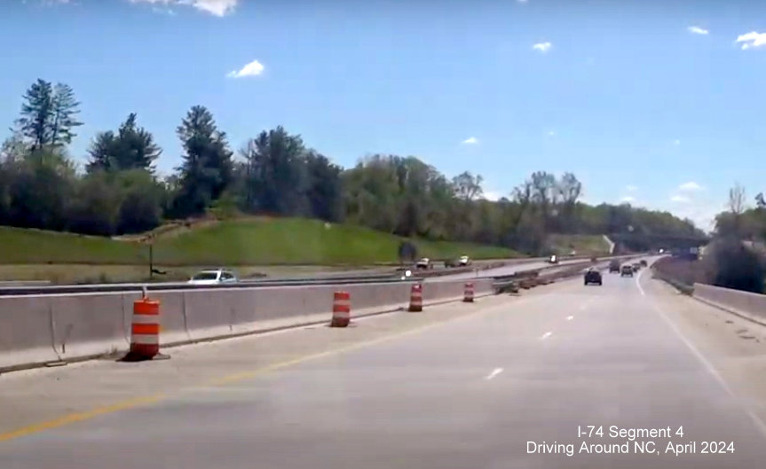 Image from US 52 South across to Future I-74 East ramp still under construction at end of the Beltway, 
        construction zone, screen grab from Driving Around NC, April 2024