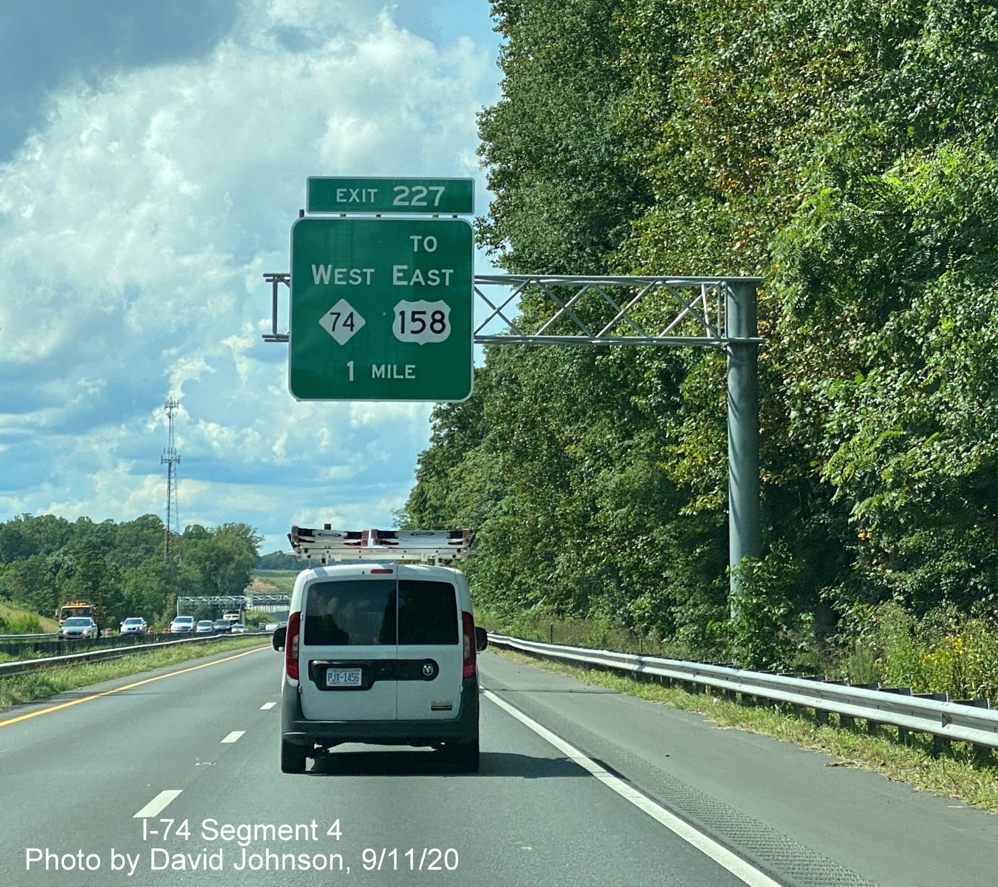 Image of newly uncovered 1-mile advance overhead sign for NC 74 West Winston Salem Northern Beltway on US 421 North Salem Parkway, by David Johnson September 2020