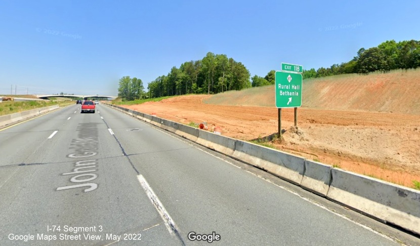 Image of existing NC 65 exit sign in graded area after future Beltway interchange, Google Maps Street 
        View, May 2022