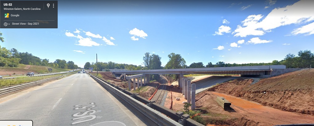 Image of new US 52 lanes bridge being constructed as part of I-74/Winston Salem Northern Beltway 
                                         interchange project, Google Maps Street View image, September 2021