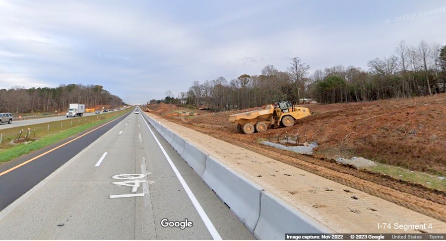 Image of equipment clearing lane along I-40 East lanes for future interchange with I-74/Winston-Salem 
       Northern Beltway in Forsyth County, Google Maps Street View, November 2022