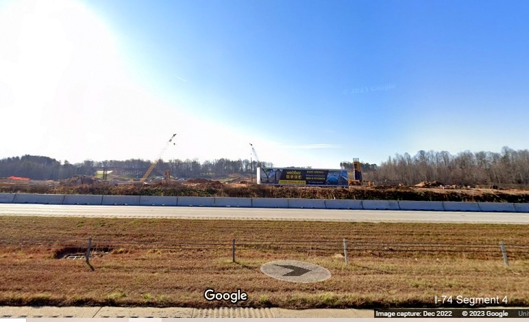 Image of grading and construction seen across I-40 West lanes for future interchange with I-74/Winston-Salem 
       Northern Beltway in Forsyth County, Google Maps Street View, December 2022