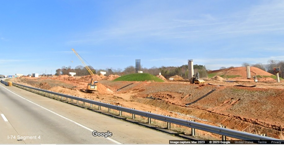 Image of construction equipment and grading at start of I-74/Winston-Salem Northern Beltway 
        construction zone along I-40 East, Google Maps Street View, March 2023