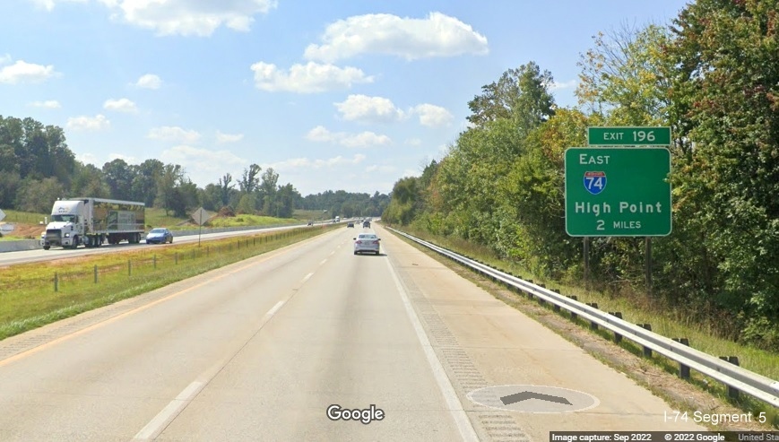 Image of ground mounted 1 mile advance sign for East I-74 exit with removed US 311 South information 
                                          on I-40 West in Forsyth County, September 2022