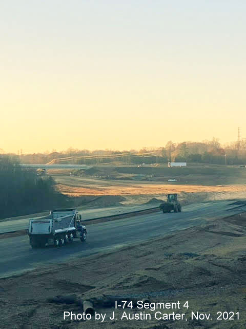 Image of closeup view looking northwest from near Stanleyville Drive showing construction of the I-74/Winston 
        Salem Northern Beltway toward University Avenue, by J. Austin Carter, November 2021