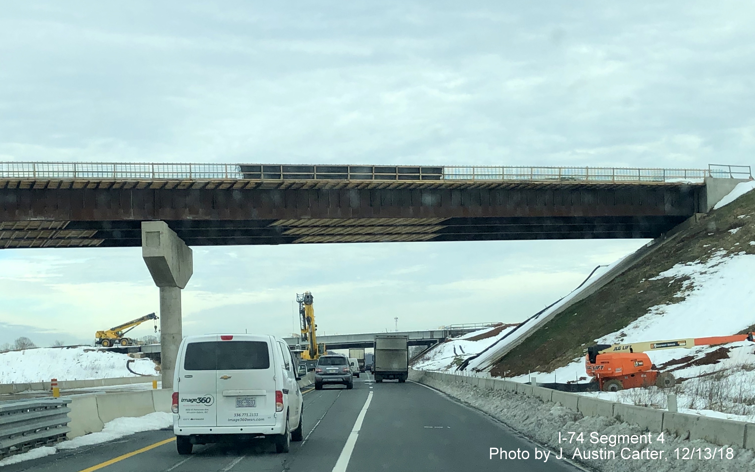 Image of closeup view of ramp bridge under construction over Business 40 East lanes for I-74/Winston-Salem Northern Beltway, by J. Austin Carter