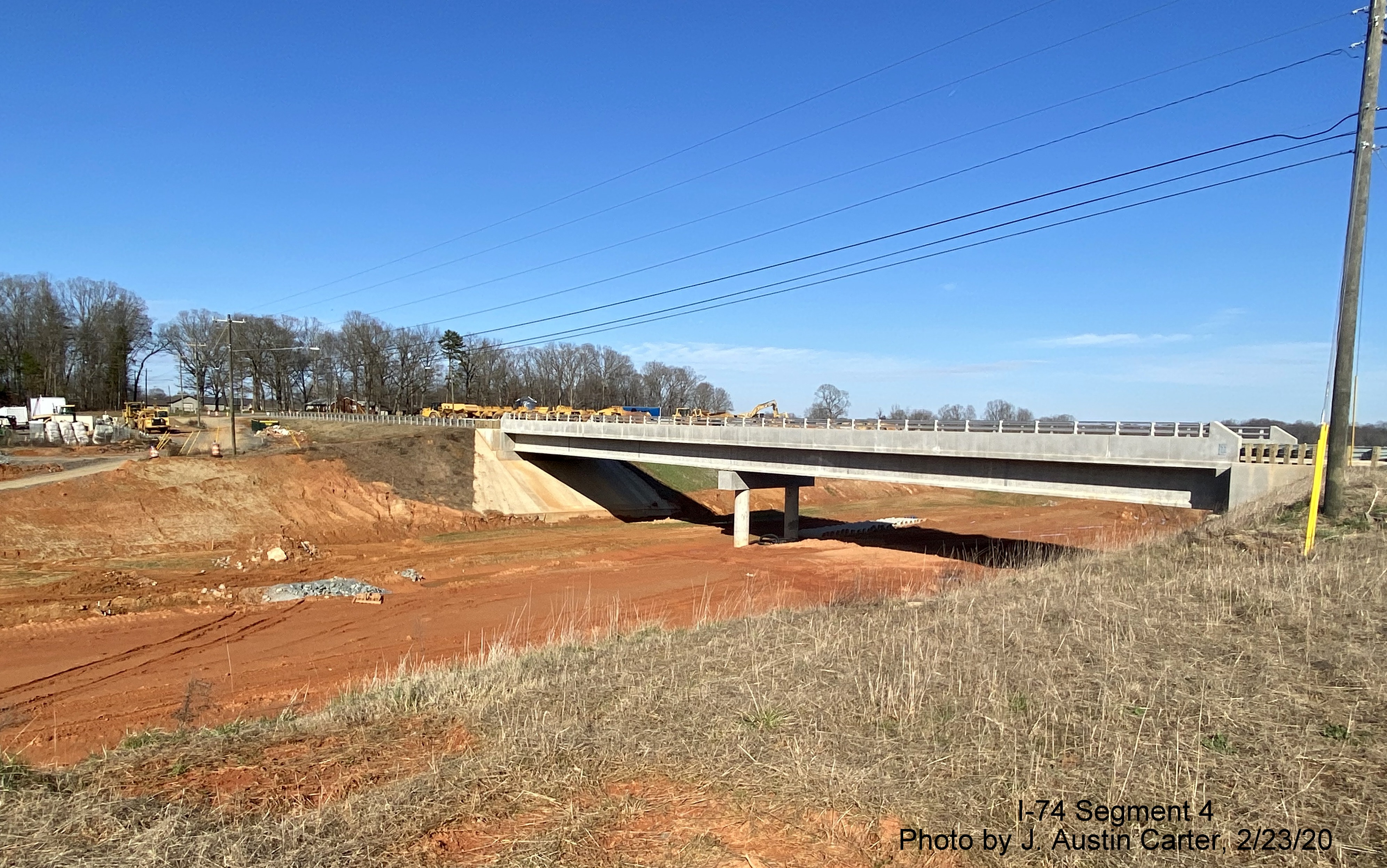 Image of completion of new Dillon Farm Road bridge over future I-74/Winston-Salem Beltway, by J. Austin 
        Carter in Feb. 2020