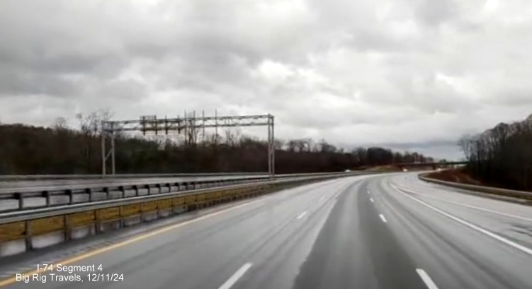 Image of lack of overhead sign for the future US 52 South exit at the ramp for NC 66/University 
        Parkway exit on completed 3 lane section of NC 74 (Future I-74) West/Winston-Salem Northern Beltway, screen grab from Big Rig Travels video, December         2024