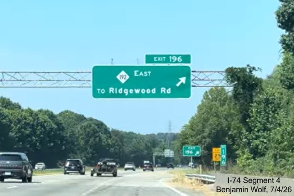 Image of new overhead 2 miles advance sign for NC 192 East, replacing the I-74 
	 East sign, at the end of the Winston-Salem Northern Beltway work zone on I-40 West, screen grab from Benjamin Wolf video, 
	 July 4, 2026