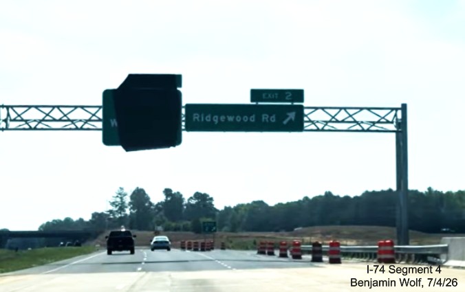 Image of new overhead signage at the Ridgewood Road exit with future I-74 West
	 exit sign covered up, screen grab from Benjamin Wolf video, July 4, 2026