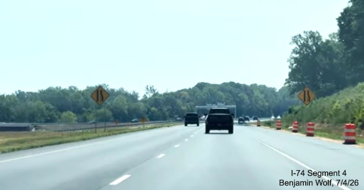 Image of new lane drop advisory signs ahead of future merge with the end of the 
	 Winston-Salem Northern Beltway, screen grab from Benjamin Wolf video, July 4, 2026