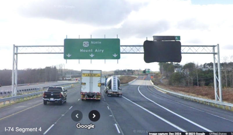 Image of covered over sign at the US 52 South exit ramp on NC 74 West/Winston-Salem
	   Northern Beltway (Future I-74), December 2024