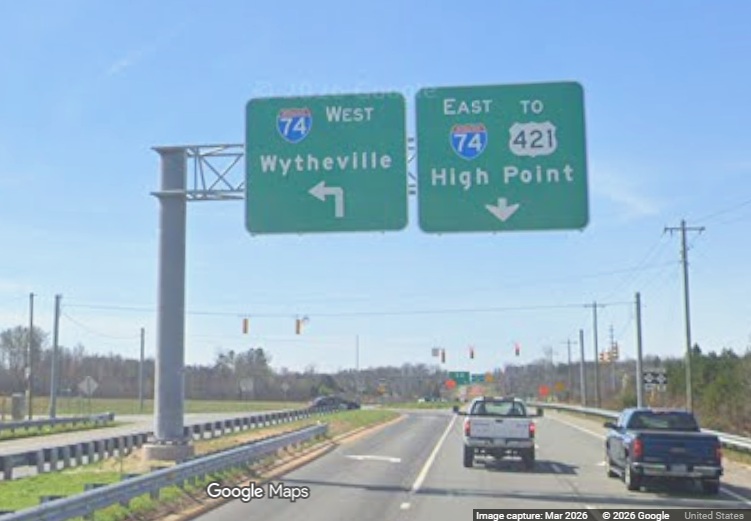 Image of new I-74 signage on US 158/Reidsville Road at the Beltway ramps, screen 
	  grab from Google Maps Street View, March 2026
