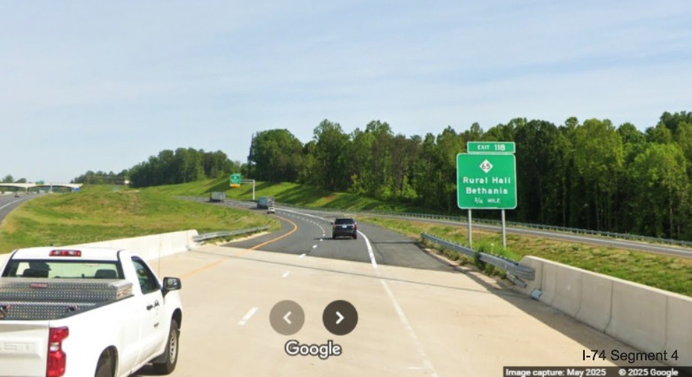 Image of recently installed 3/4 mile advance
	  ground mounted sign for the NC 65 exit on US 52 North in Rural Hall, Google Maps Street View, 
	  May 2025
