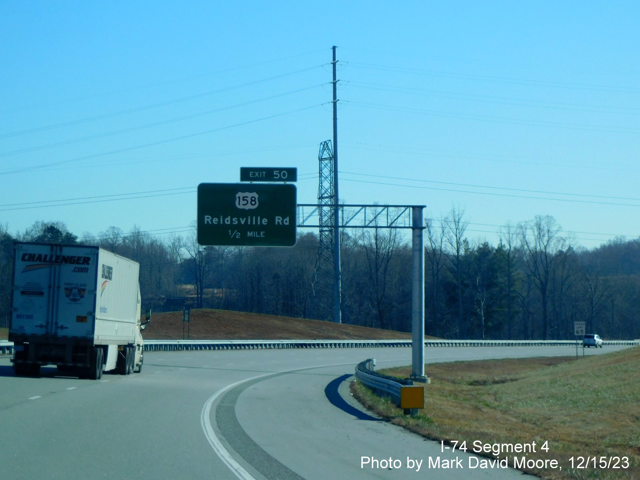 Image of 1/2 Mile advance overhead sign for US 158 exit on NC 74 (Future I-74) East/
        Winston-Salem Northern Beltway, by Mark David Moore, December 2023